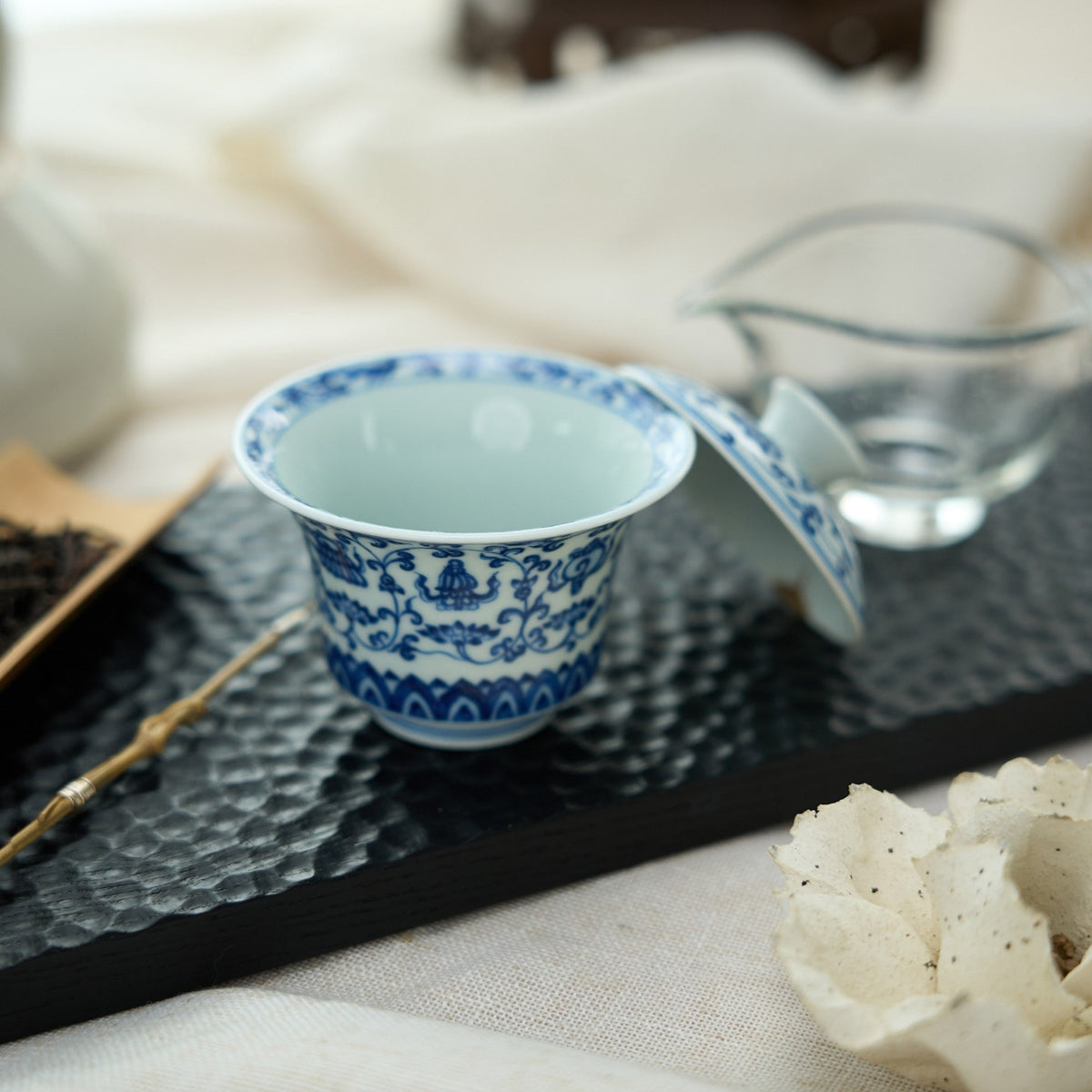 Eight Treasures & Scrolling Lotus Porcelain Gaiwan in a styled gongfu tea setting