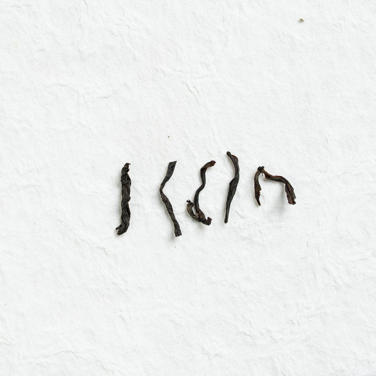 Close-up of Feizi Xiao Wuyi Black Tea loose tea leaves