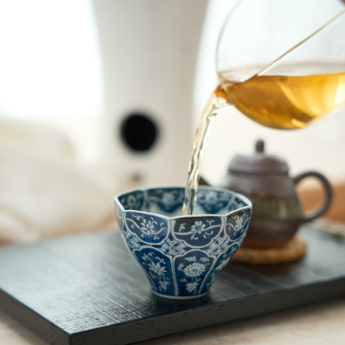 Floral Blue-and-White Octagonal Tea Cup in a styled gongfu tea setting