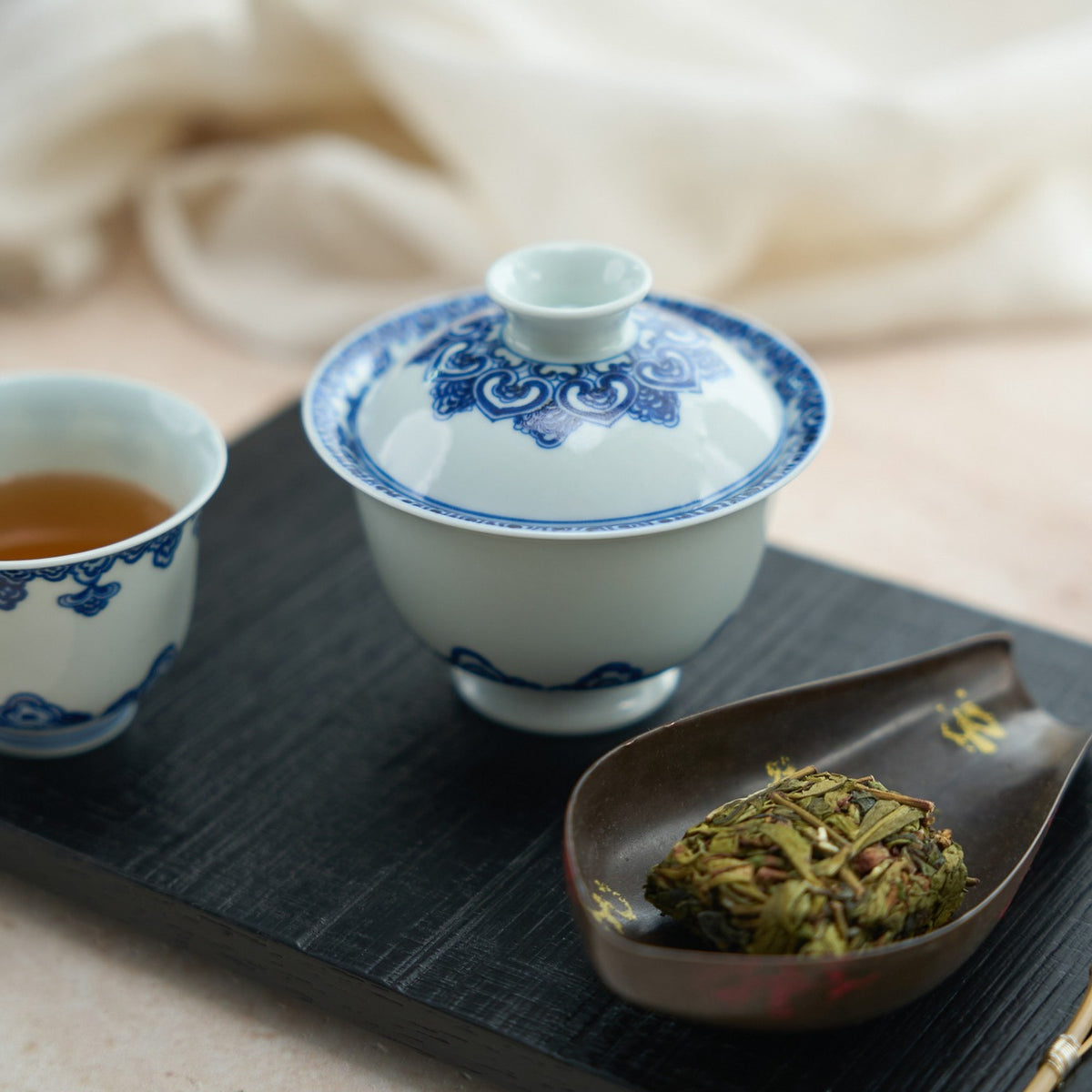 Baoxiang Floral Blue-and-White Porcelain Gaiwan in a styled gongfu tea setting