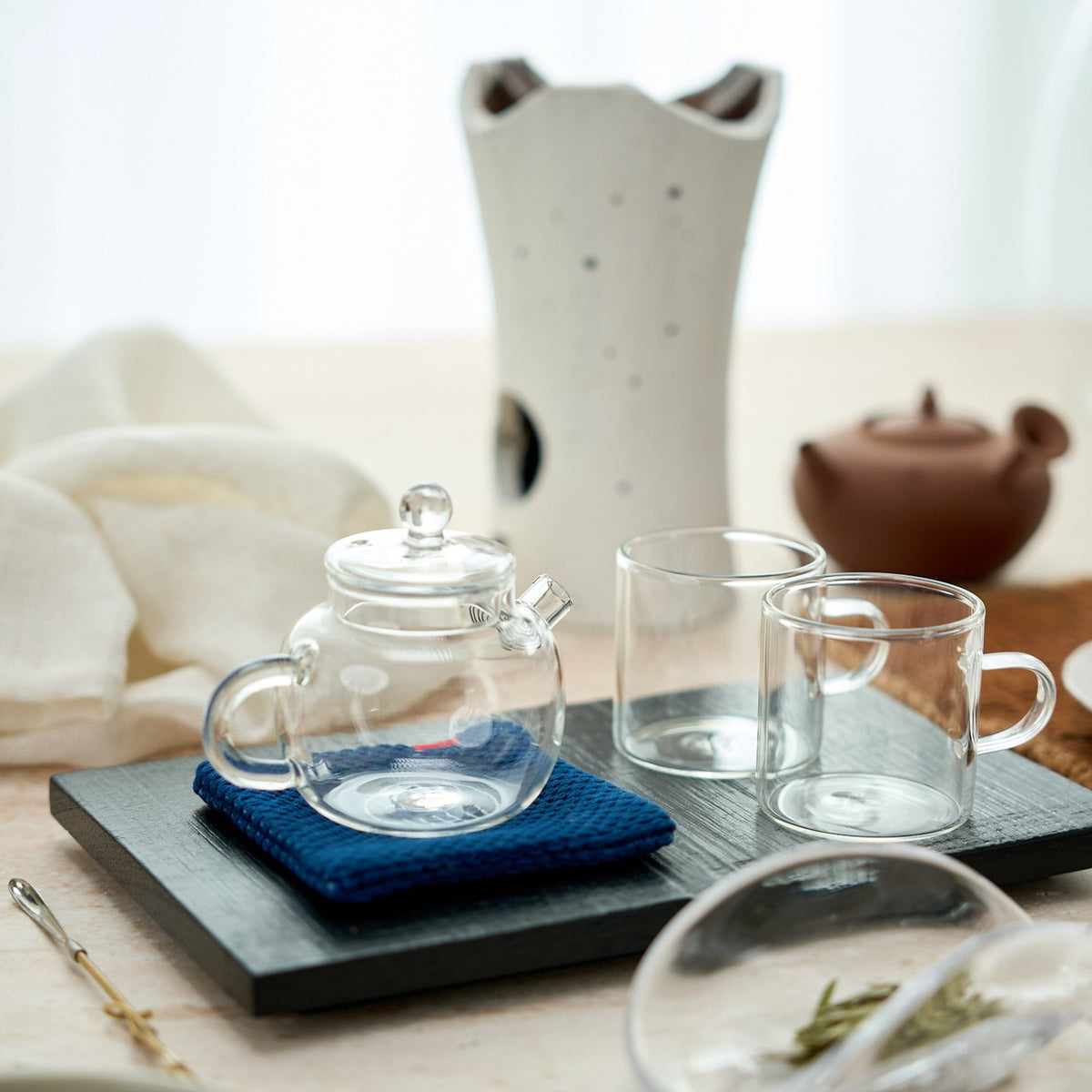 Glass Gongfu Teapot in a styled gongfu tea setting