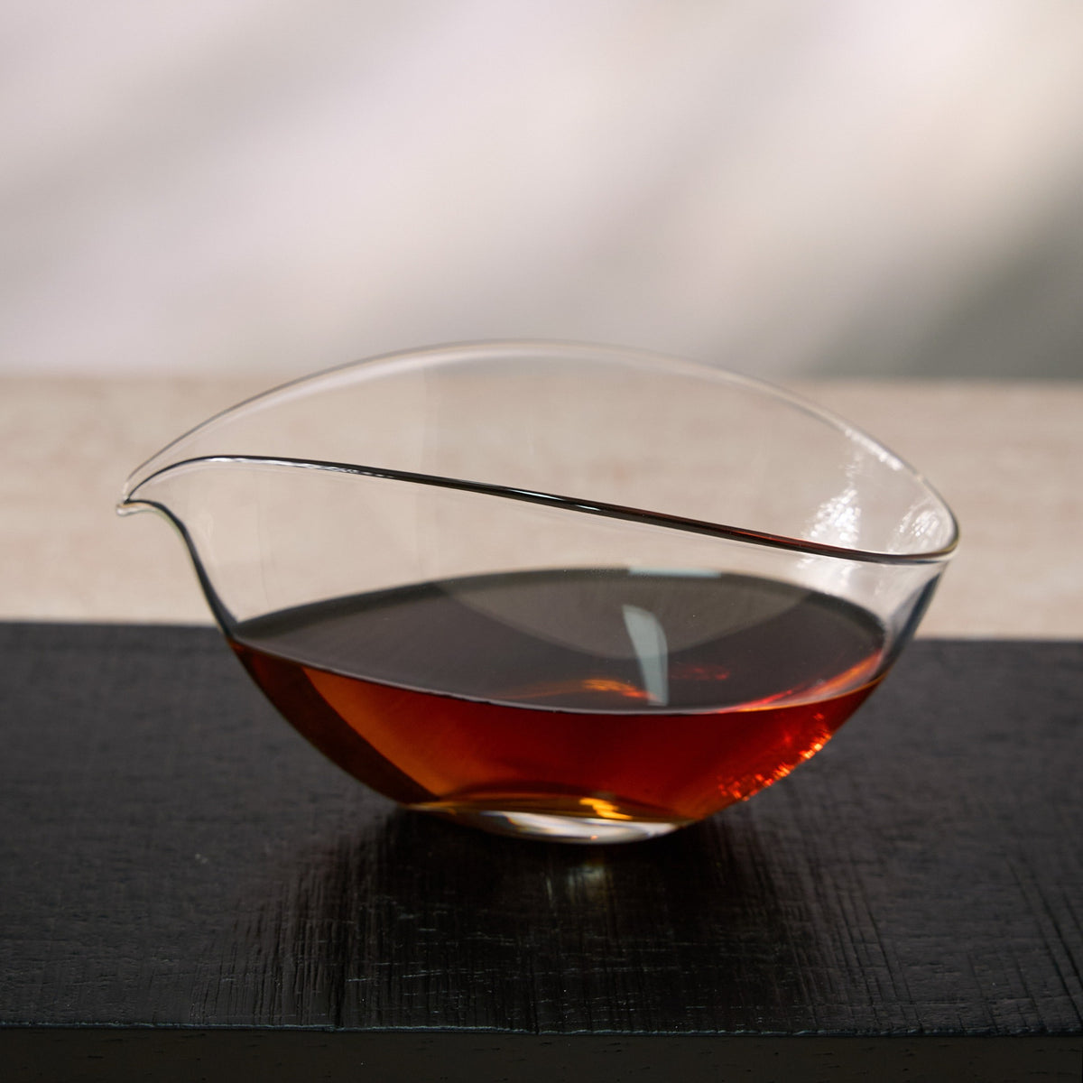 Leaf Boat Glass Fairness Pitcher filled with brewed tea