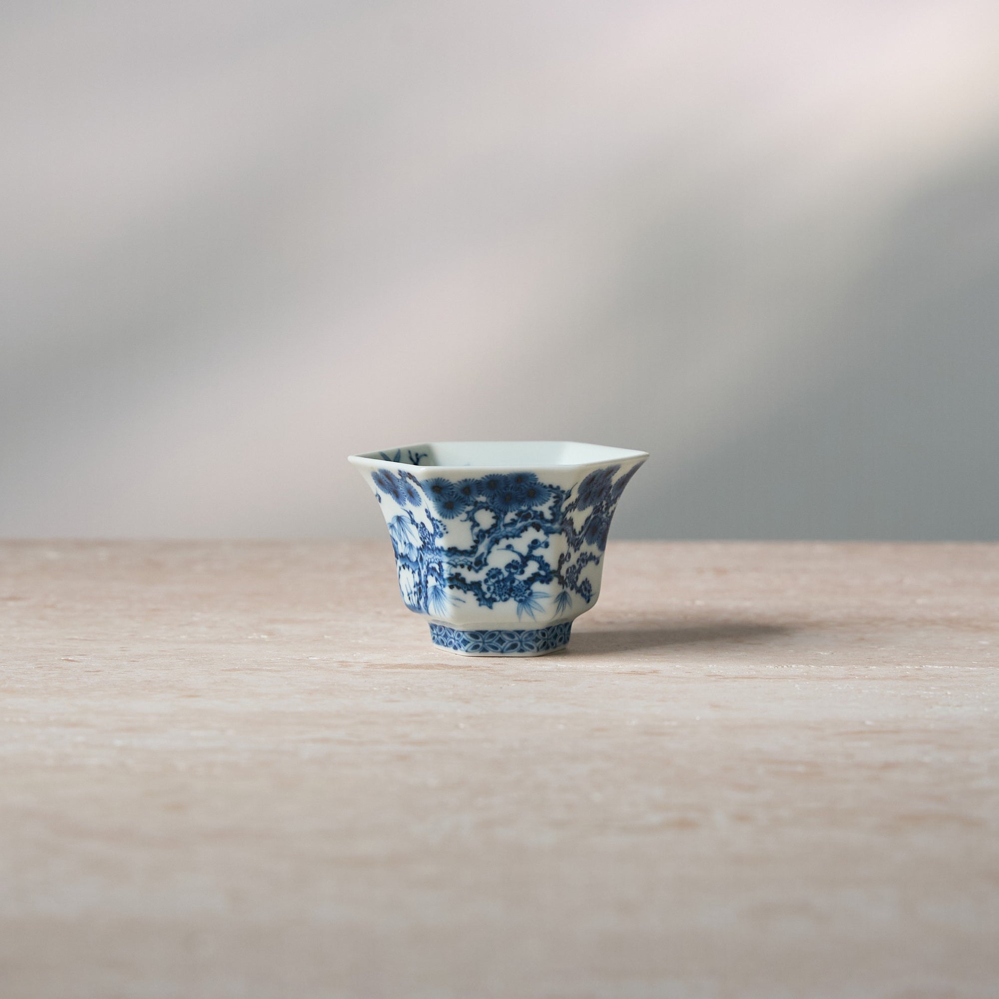 Front view of Three Friends of Winter Hand-Painted Octagonal Tasting Cup