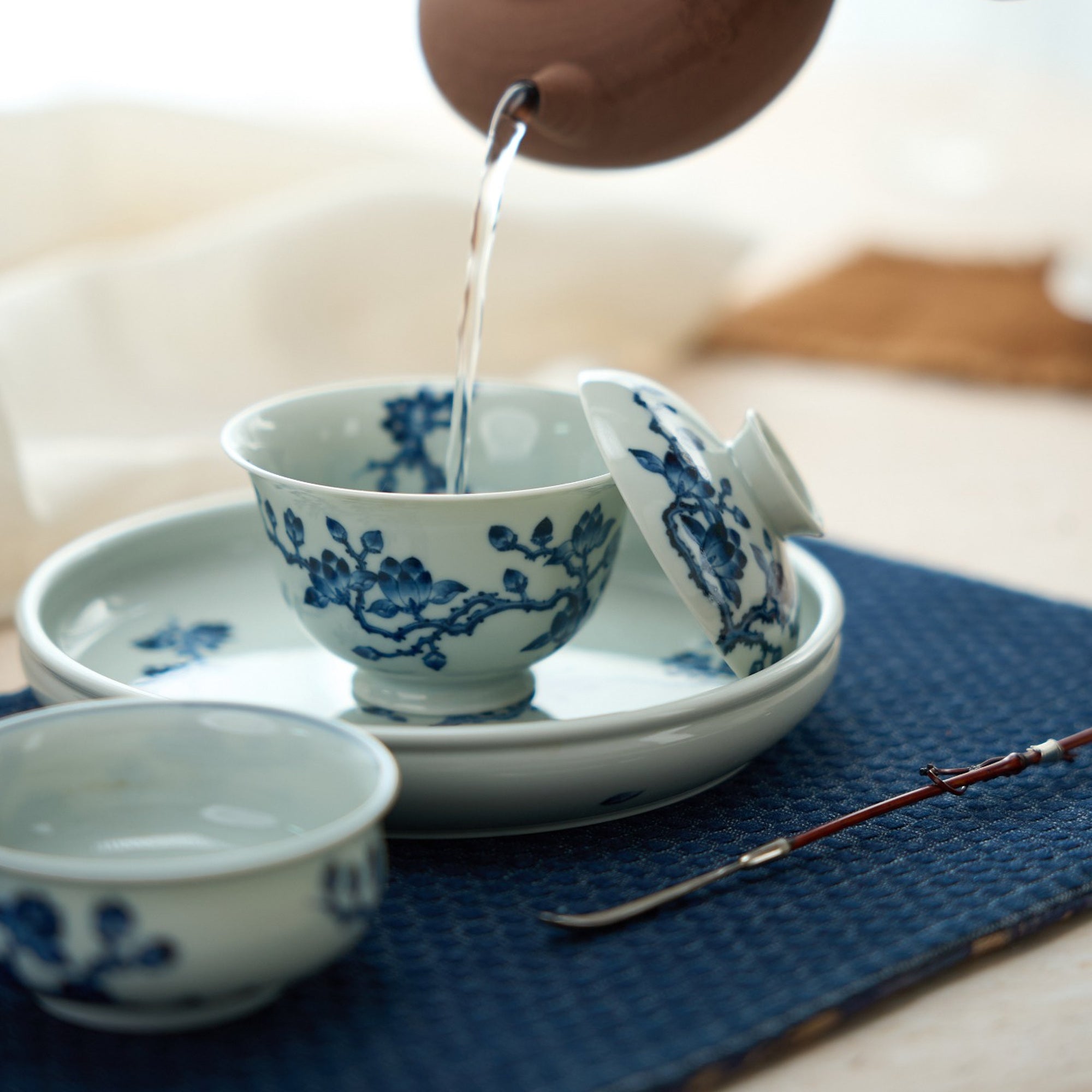 White Magnolia Blue-and-White Porcelain Gaiwan in a styled gongfu tea setting