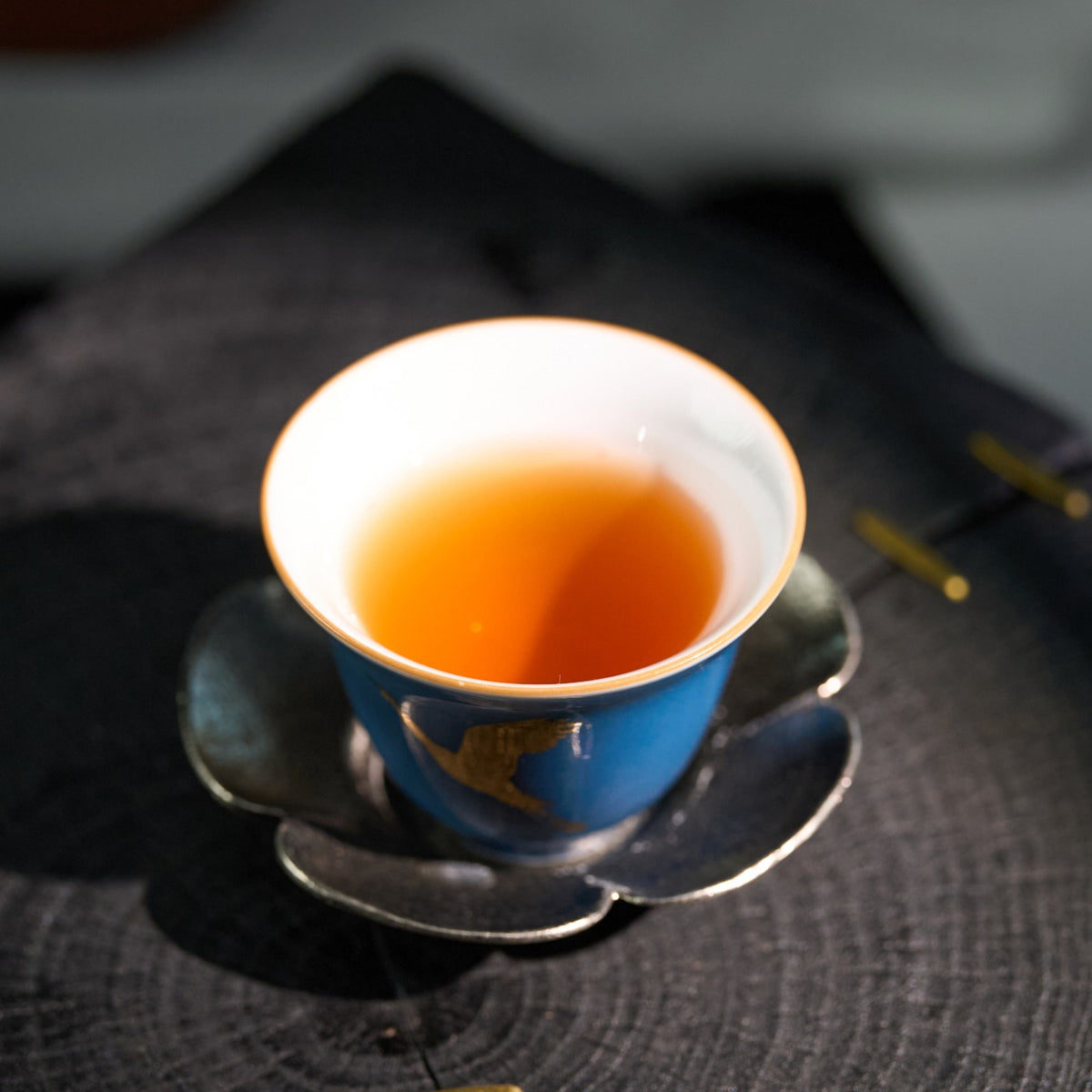Styled tea scene featuring Wild Forest Sun-Dried Black Tea
