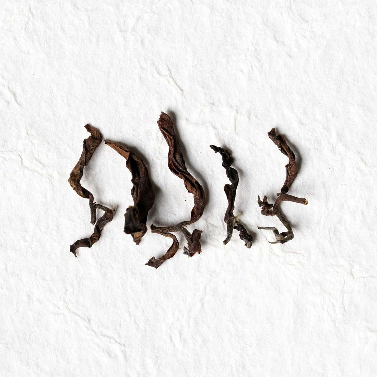 Close view of individual Oriental Beauty Oolong Tea leaves